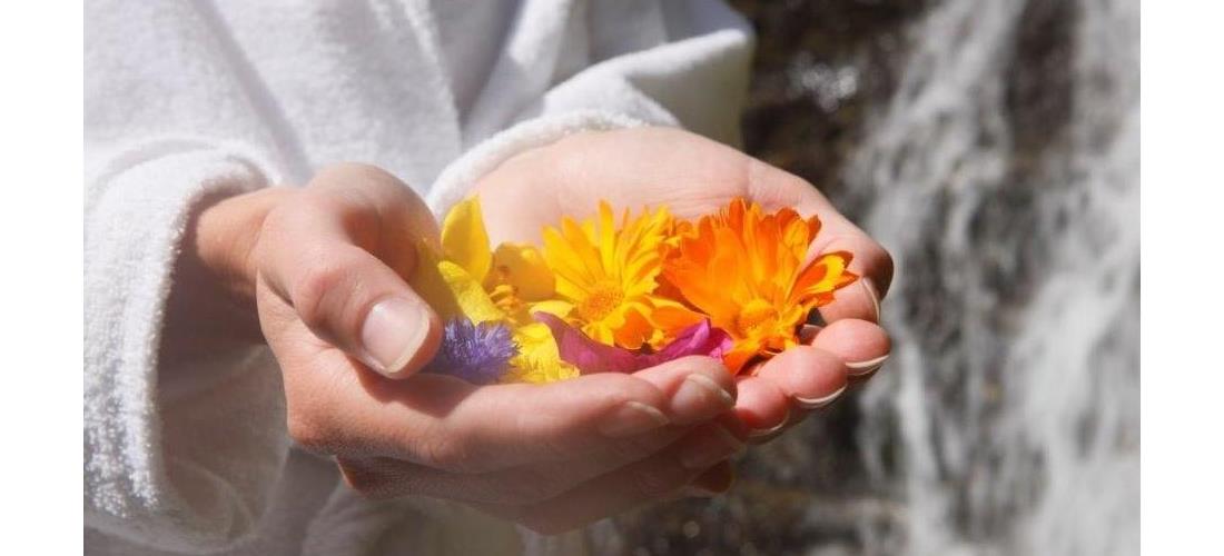 A woman is holding flowers