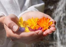 A woman is holding flowers