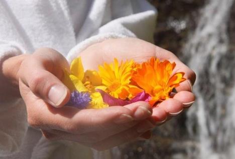 A woman is holding flowers